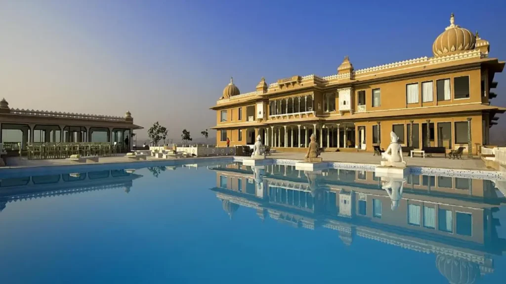A shot of the exteriors and outdoor swimming pool at Fateh Garh Resort in Udaipur.