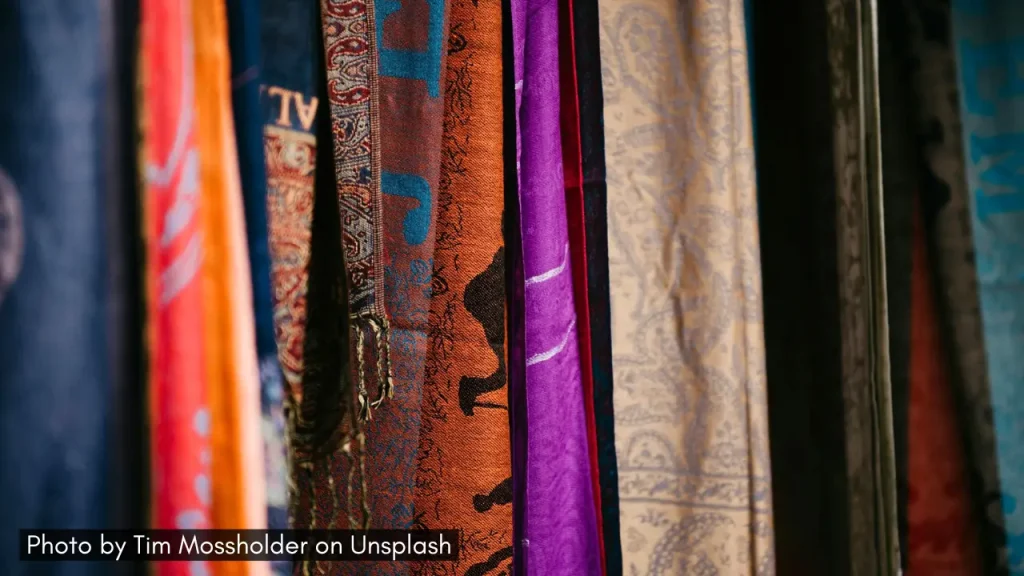 A shot of scarves and stoles on a shelf ideal as a Diwali gift for winter months.
